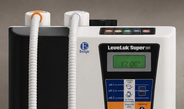 Le système à double tuyau et le panneau de commande du Super 501 avec le minuteur de production en marche